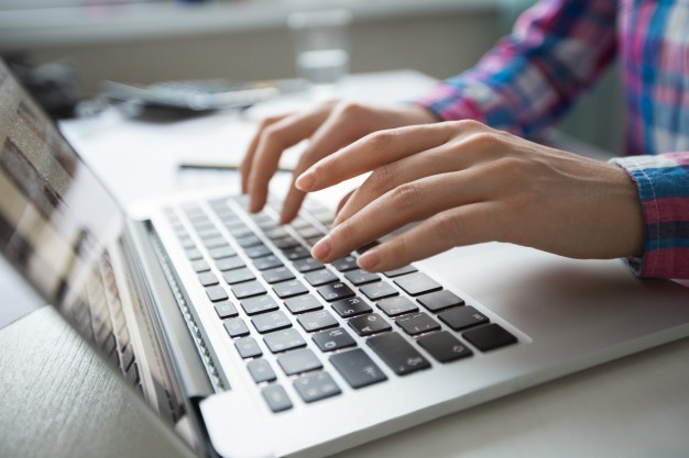 UT Democrats cropped view of hands typing on laptop